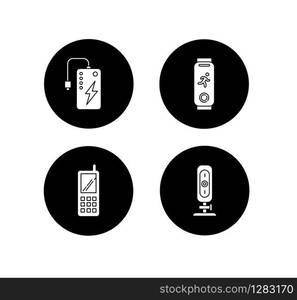 Mobile devices glyph icons set. Pocket electronic gadgets. Smart technology. Powerbank. Fitness tracker. Cell phone, web camera. Digital tools. Vector white silhouettes illustrations in black circles