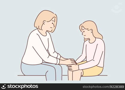 Mom holds hand of sad teenager daughter helps to get rid stress and consoles after quarrel with friends. Caring woman giving support to daughter suffering from depression due to bad grades in school. Mom holds hand of sad teenager daughter helps to get rid stress and consoles after quarrel