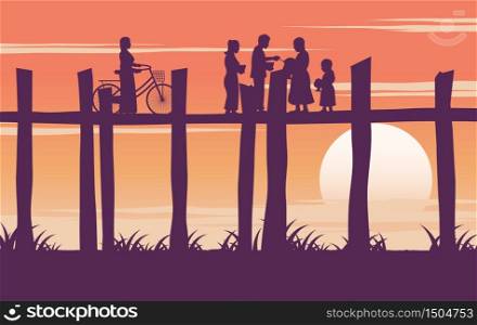 monk ask for food and woman hold bicycle on wooden bridge in the morning