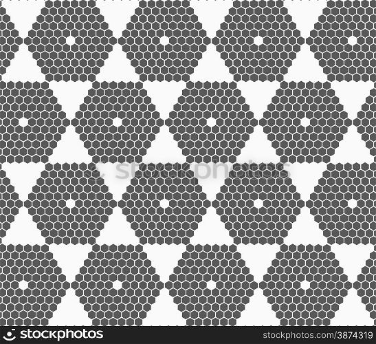 Monochrome abstract geometrical pattern. Modern gray seamless background. Flat simple design.Gray small hexagons forming hexagons.