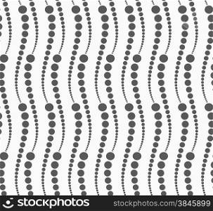 Monochrome dotted texture. Abstract seamless pattern. Ornament made of dots.Textured with dots vertical snakes.