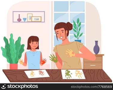 Mother and daughter painting at home. Mom and child study or playing together. Woman teaches girl to draw. Happy family pastime. People paint hands with dye and leaves traces of palms on paper. People paint hands with dye and leaves traces of palms on paper. Mother and daughter painting
