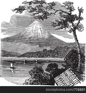 Mount Fuji in Japan, during the 1890s, vintage engraving. Old engraved illustration of Mount Fuji, with Lake Kawaguchi and trees in front.