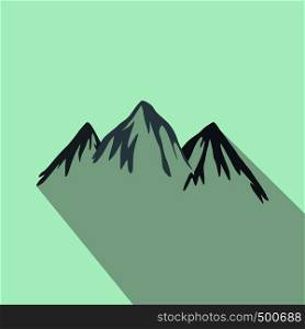 Mountain icon in flat style on a light blue background . Mountain icon, flat style