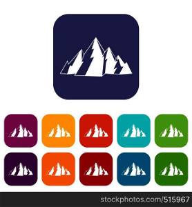 Mountain icons set vector illustration in flat style in colors red, blue, green, and other. Mountain icons set