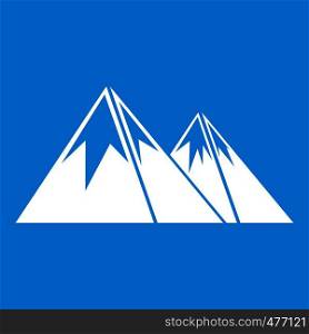 Mountains with snow icon white isolated on blue background vector illustration. Mountains with snow icon white