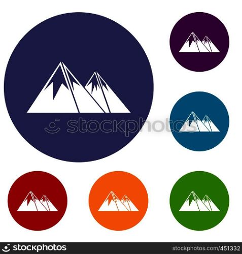 Mountains with snow icons set in flat circle reb, blue and green color for web. Mountains with snow icons set
