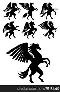Mythical gorgeous winged pegasus black horses with open wings. Heraldry, coat of arms, equestrian sport symbols or tattoo design usage. Rearing winged pegasus black horses