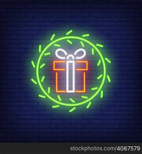 Neon gifts in fur wreath. Night bright advertisement element. Vector illustration in neon style for Christmas, New Year, holiday, festive design