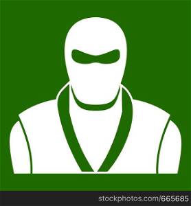 Ninja in black mask icon white isolated on green background. Vector illustration. Ninja in black mask icon green