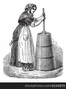 Old engraved illustration of Woman churning butter with ordinary plunger. Industrial encyclopedia E.-O. Lami - 1875.