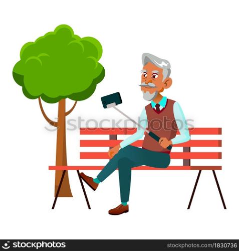 Old Man Making Selfie On Phone In Park Vector. Hispanic Pensioner Guy Holding Selfie Stick With Smartphone For Make Photo On Cellphone Camera. Character Enjoying Outside Flat Cartoon Illustration. Old Man Making Selfie On Phone In Park Vector