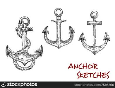 Old nautical anchors of medieval sailboats or pirate ships, decorated by ropes. May be used as t-shirt print, navy symbol or adventure design. Sketch style. Heraldic ship anchors, sketch icons