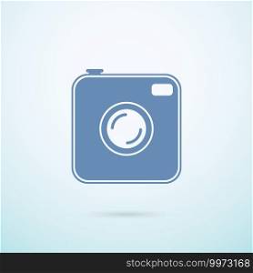 Old photocamera flat icon on blue background.