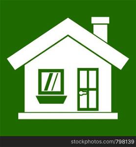 One-storey house with a chimney icon white isolated on green background. Vector illustration. One-storey house with a chimney icon green