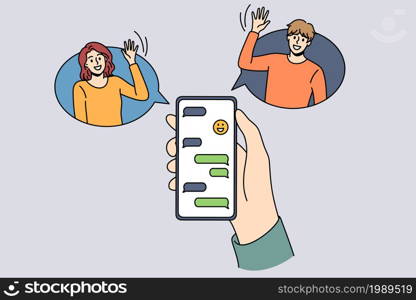 Online chat and technologies concept. Human hand holding smartphone with chat and smiling friends greeting from sides vector illustration . Online chat and technologies concept.