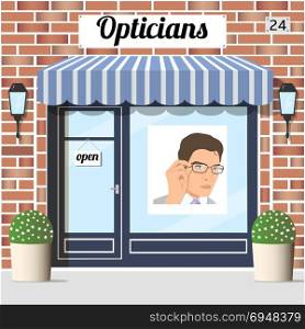 Opticians shop building with red bricks facade.. Opticians shop building with red bricks facade. window Poster of a young man in glasses. EPS 10 vector.