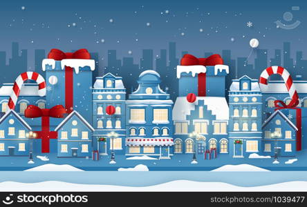 Origami Paper art of background of town with Christmas gift in winter season, Merry Christmas and Happy New Year