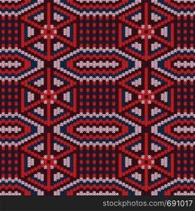 Ornate knitting seamless vector pattern in red hues and blue colors as a fabric texture