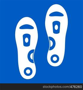 Orthopedic insoles icon white isolated on blue background vector illustration. Orthopedic insoles icon white