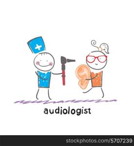 otolaryngologist stands next to the patient who holds a large ear