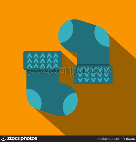 Pair of blue baby socks icon. Flat illustration of pair of blue baby socks vector icon for web on yellow background. Pair of blue baby socks icon, flat style