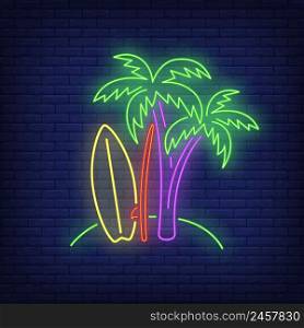 Palm trees and surfboards on beach neon sign. Surfing, extreme sport, tourism design. Night bright neon sign, colorful billboard, light banner. Vector illustration in neon style.