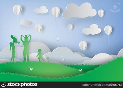 Paper art of Green happy family having fun playing in the field
