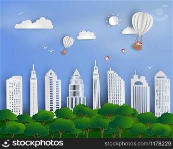 Paper art scene abstract background,hot air balloon with gift box floating above urban city landscape,vector illustration