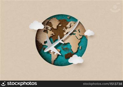 paper cut with airplane fly around the planet Earth, concept of travel and tourism.