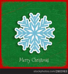 Paper snowflake on Christmas vintage background