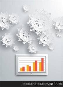 Paper snowflakes and modern device on gray background