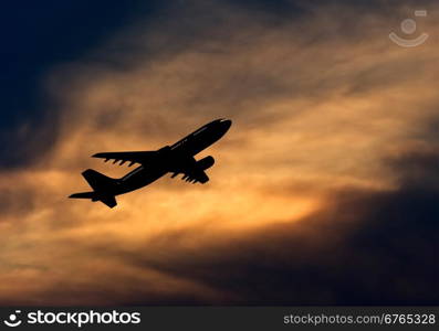 Passenger jet airplane silhouette in blurred sunset sky. Vector illustration.