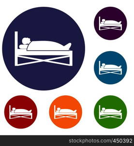Patient in bed in hospital icons set in flat circle reb, blue and green color for web. Patient in bed in hospital icons set