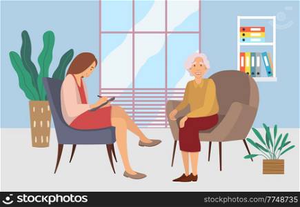 Patients at a reception at the psychotherapies. Elderly woman talking to psychotherapist or psychologist and answer questions. Female sits in a chair, listens and writes to the client&rsquo;s problems. Patients at a reception at the psychotherapies. Elderly woman talking to psychotherapist
