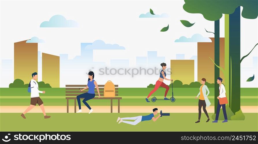 People doing sports and relaxing in city park. Relaxation, activity, lifestyle concept. Can be used for topics like summer, leisure, nature. People doing sports and relaxing in city park