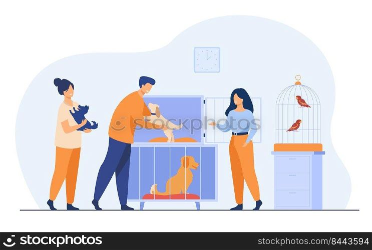 Pet store or animal shelter concept. Man taking puppy from cage, buying or adopting dog. Volunteers helping to choose homeless animal for adoption