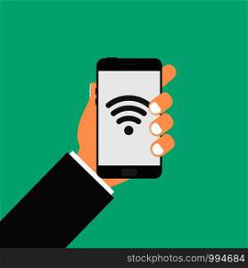 Phone in hand . wi-fi sign on screen