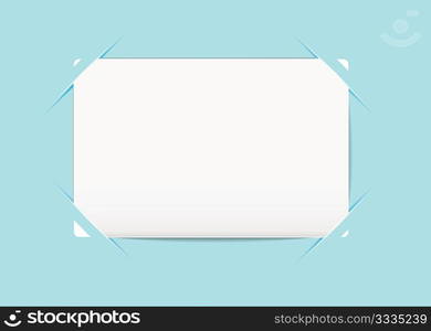 Plain white business card stuck to a blue paper background