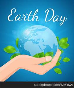 Planet Earth and green leaves in hand on a blue background. Card for Earth Day.