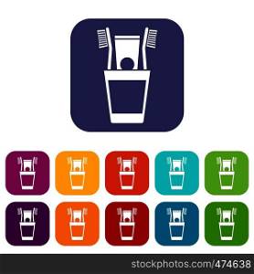 Plastic cup with brushes icons set vector illustration in flat style In colors red, blue, green and other. Plastic cup with brushes icons set
