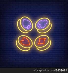 Playing card suit symbols on gold coins neon sign. Gambling and poker club design. Night bright neon sign, colorful billboard, light banner. Vector illustration in neon style.