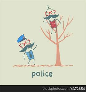Police near the tree on which sits a criminal