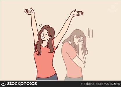 Positive woman raises hands up and rejoices having got rid of bad emotions and depression spoiling mood. Crying doppelganger behind girl for concept of mood swings or split personality. Woman raises hands up and rejoices having got rid of bad emotions and depression spoiling mood