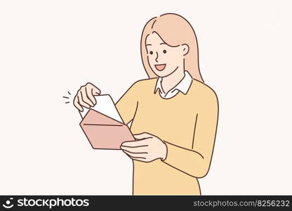 Positive woman with envelope received invitation to wedding ceremony of friends or colleagues. Happy woman looking at voucher or gift certificate giving right to purchase or use services for free . Positive woman with envelope received invitation to wedding ceremony of friends or colleagues