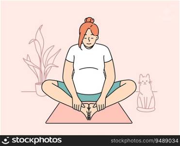 Pregnant woman making morning exercises sitting on fitness mats and getting ready for meditative practices from yoga. Pregnant girl is at home and stretches doing yoga for expectant mothers. Pregnant woman doing morning exercises sitting on fitness or yoga mats in apartment