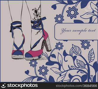 pretty legs with tattoo in trendy summer heels on a floral background