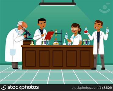 Professional chemists in their laboratory makes different experiments on the table. Male and female medical workers. Chemistry science education in laboratory, research and experiment. Professional chemists in their laboratory makes different experiments on the table. Male and female medical workers