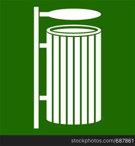 Public trash can icon white isolated on green background. Vector illustration. Public trash can icon green