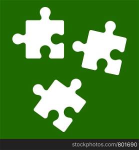 Puzzle icon white isolated on green background. Vector illustration. Puzzle icon green